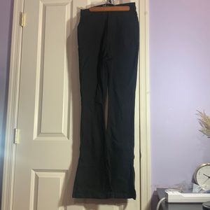 Black flare leg denim pant with slits at the bottom